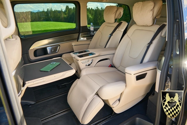 A luxurious private car service in Munich, showcasing a sleek vehicle ready for passengers.