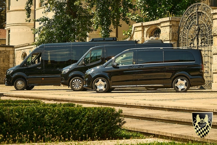 The image features a sleek Mercedes Benz Sprinter van parked in a scenic location, showcasing its spacious cargo area and comfortable interior, ideal for large groups or families on a road trip. This versatile vehicle, known for its reliability and advanced features, is perfect for those looking to rent a van for various occasions, whether for business or leisure.